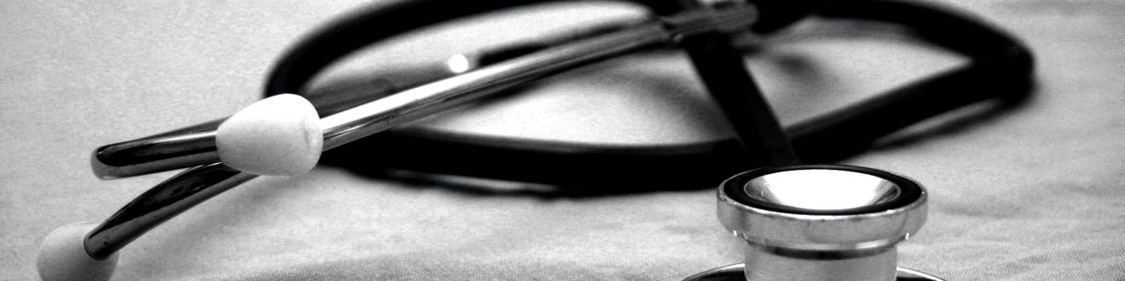 A stethoscope on a grey cloth