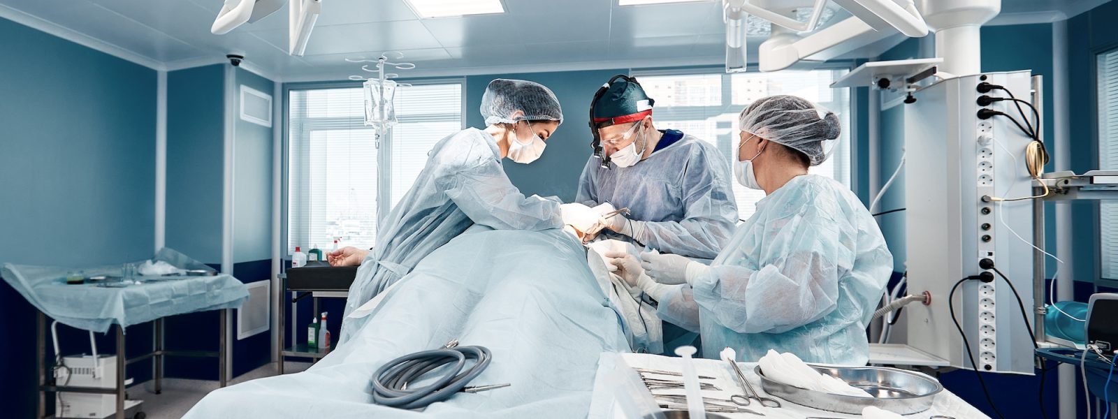 Operating room team of surgeons