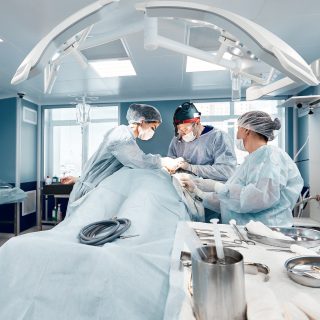 Operating room team of surgeons